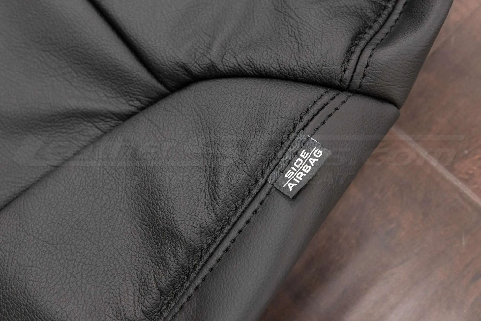 2010-2013 Kia Forte Upholstery Kit- Black - Front backrest airbag tag