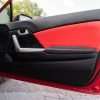 Honda Civic installed leather kit - Black & Bright Red - Door panel insert close-up