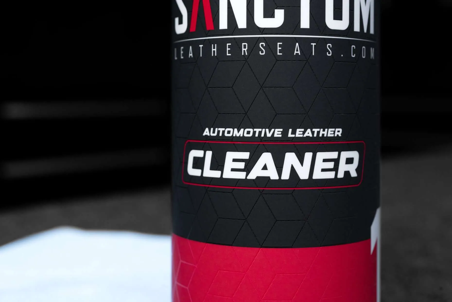16oz bottle of Sanctum automotive leather cleaner with microfiber towel - close view of product name