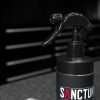 16oz bottle of Sanctum automotive leather cleaner with microfiber towel - close up of sprayer nozzle