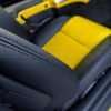 2003-2006 Chevrolet SSR Leather Kit - Black & Velocity Yellow - Installed - Black double-stitching close up