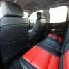GMC Sierra leather upholstery kit - Black and Bright Red - Installed - Back view of front seats