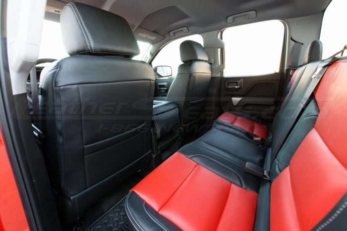 GMC Sierra leather upholstery kit - Black and Bright Red - Installed - Back view of front seats