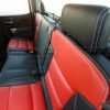 GMC Sierra leather upholstery kit - Black and Bright Red - Backseat headrest close-up