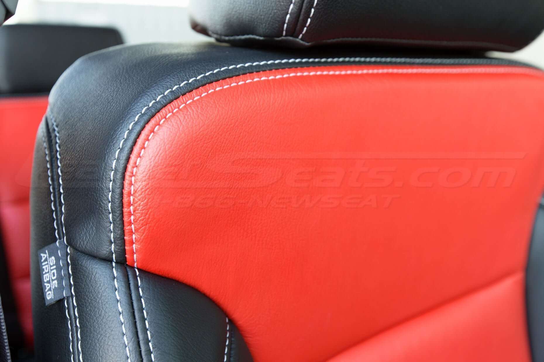 GMC Sierra leather upholstery kit - Black and Bright Red - Front double- stitching close-up