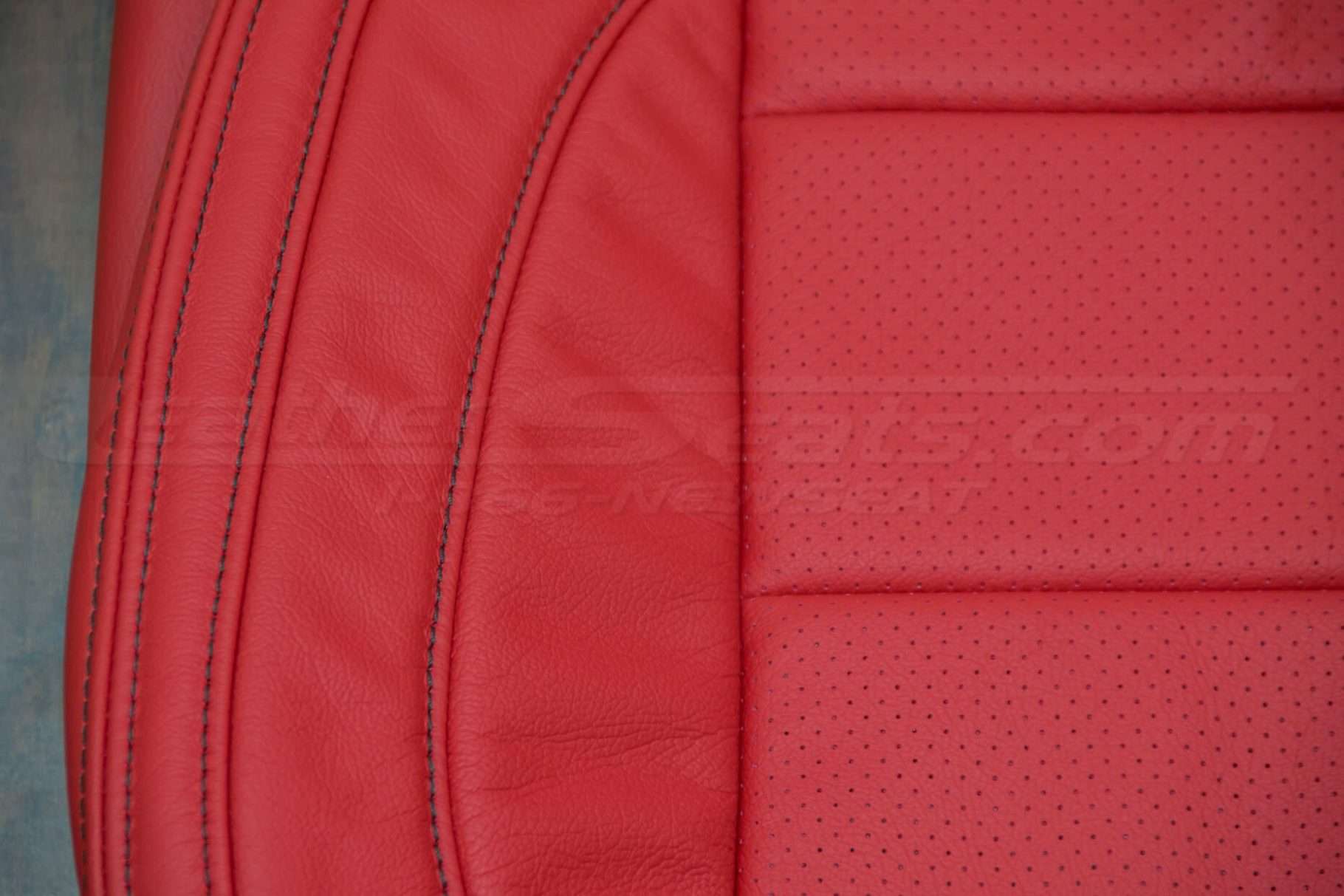 Ford Mustang Bright Red Upholstery Kit - Perforation and leather comparison with double-stitching