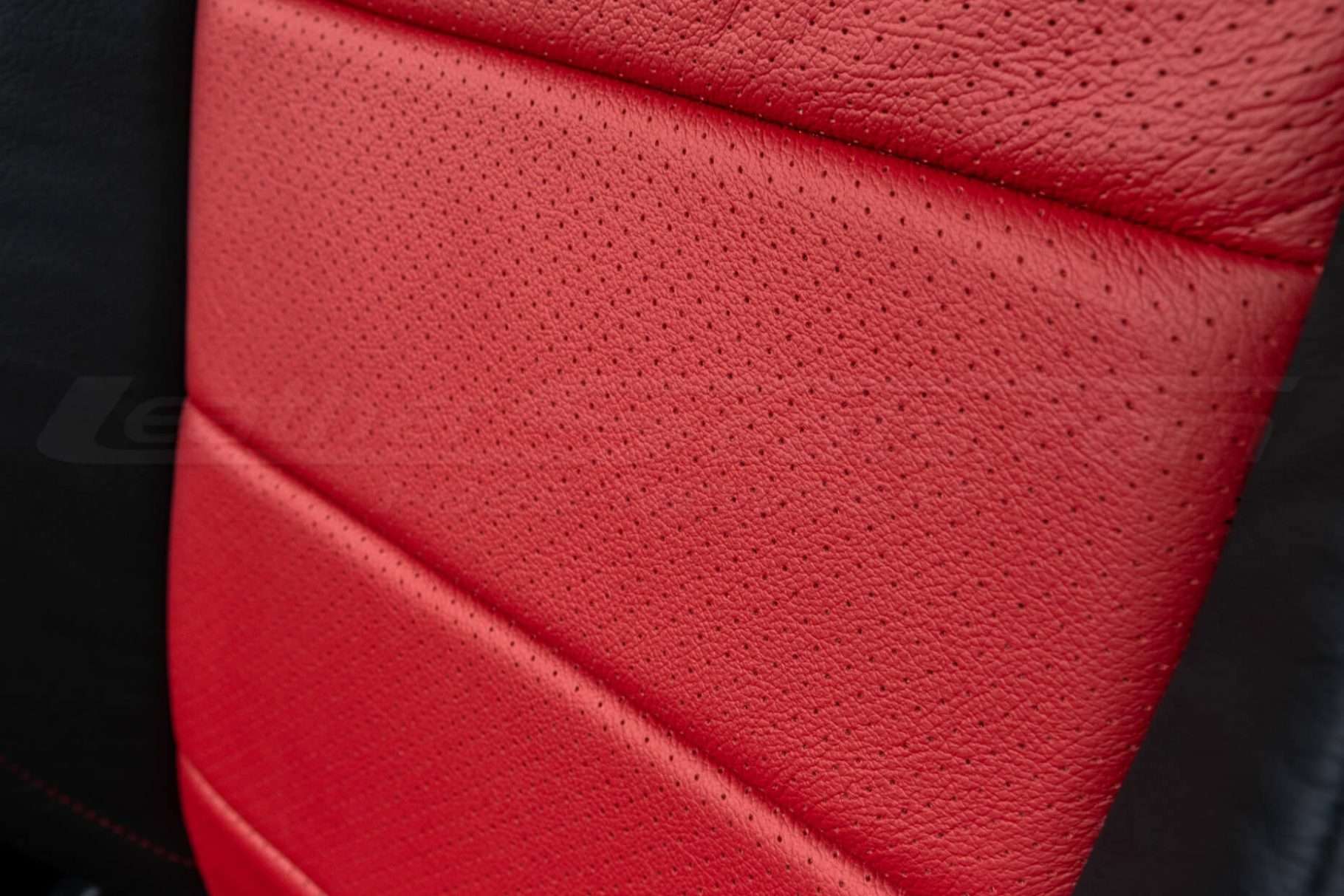 Ford Mustang installed leather kit - Black & Bright Red - Perforation close-up