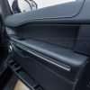 Ford Expedition Leather Upholstery Kit - Black - Installed - Door armrest angled view