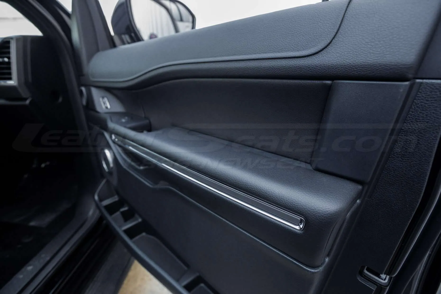 Ford Expedition Leather Upholstery Kit - Black - Installed - Door armrest angled view