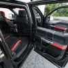 Ford Raptor installed upholstery kit - Black & Bright Red - Door armrests