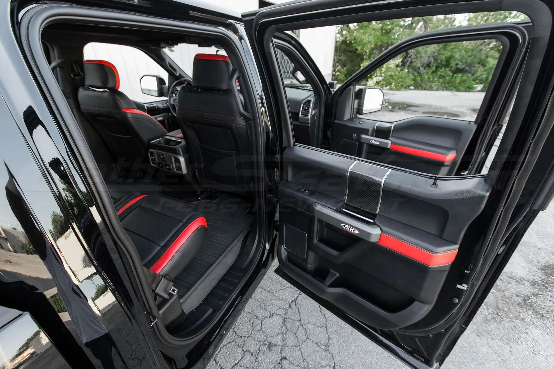 Ford Raptor installed upholstery kit - Black & Bright Red - Door armrests