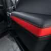 Ford Raptor installed upholstery kit - Black & Bright Red - Door armrest close-up