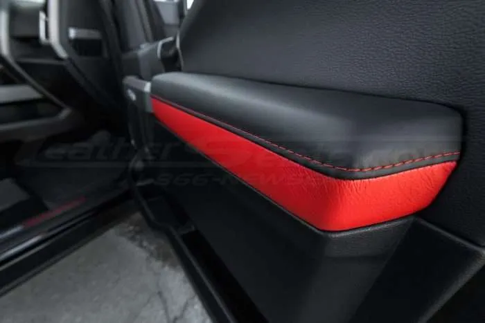Ford Raptor installed upholstery kit - Black & Bright Red - Door armrest close-up