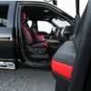 Ford Raptor installed upholstery kit - Black & Bright Red - Armrest with interior in the background