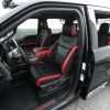 Ford Raptor installed upholstery kit - Black & Bright Red - Front seat wide angle