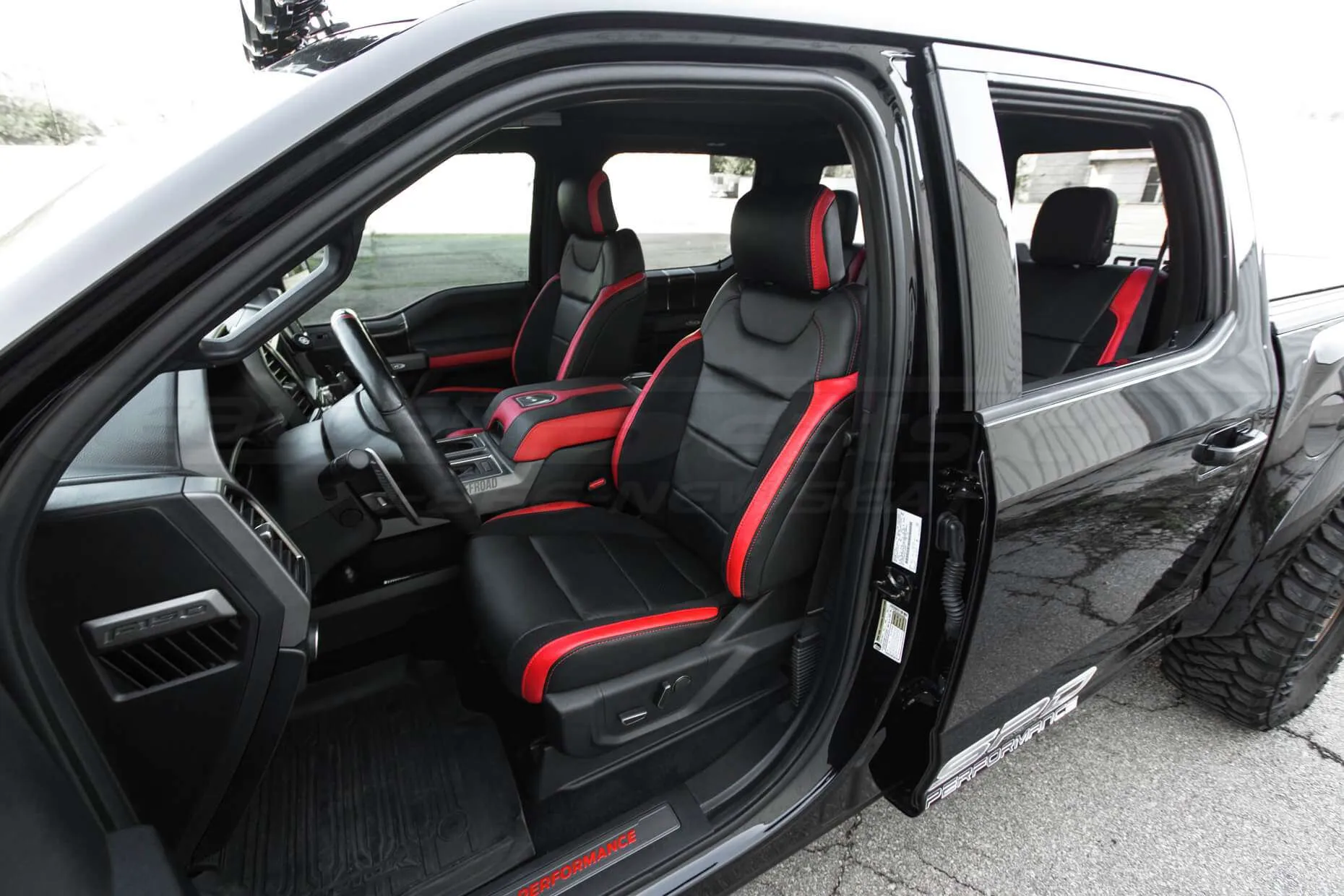 Ford Raptor installed upholstery kit - Black & Bright Red - Front seat wide angle
