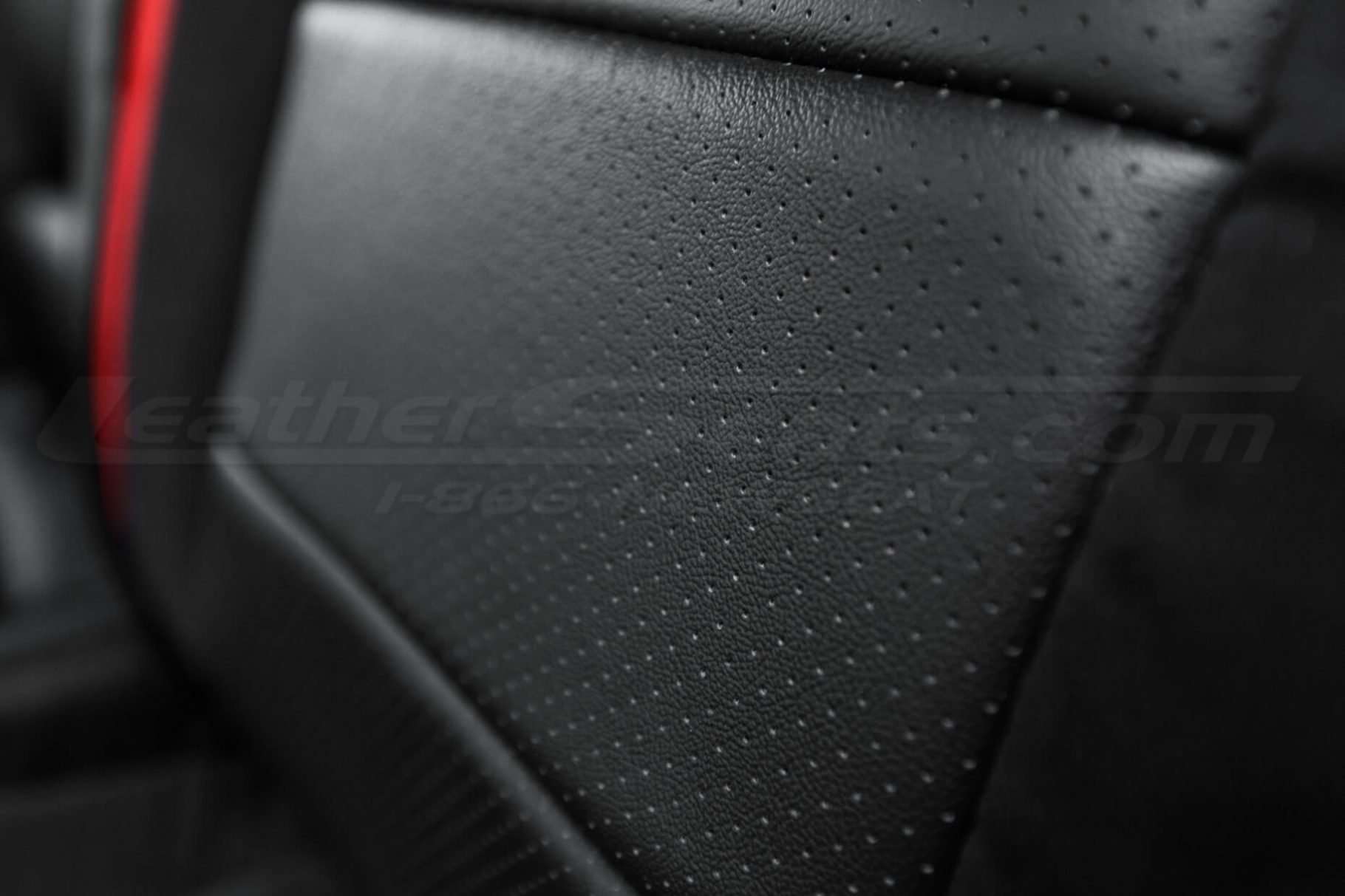 Ford Raptor installed upholstery kit - Black & Bright Red - Backrest perforation close-up