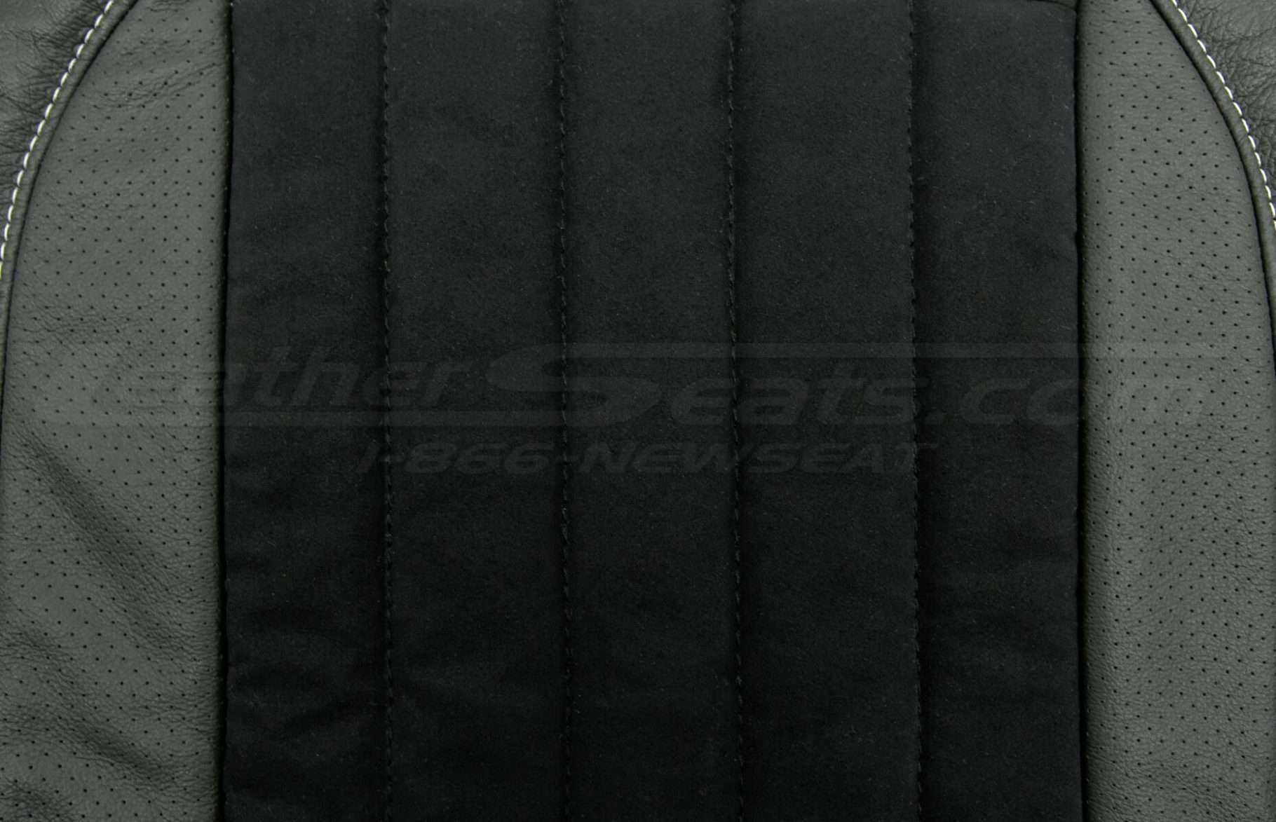 Perforated wings and black suede insert close-up