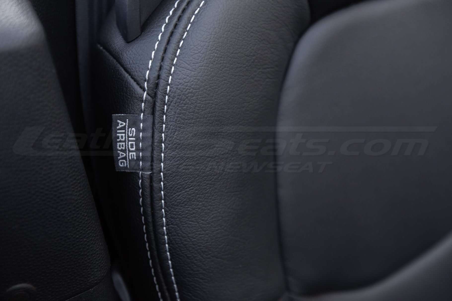 Mazda Mazda Miata Installed Leather - Black - Front backrest side airbag tag