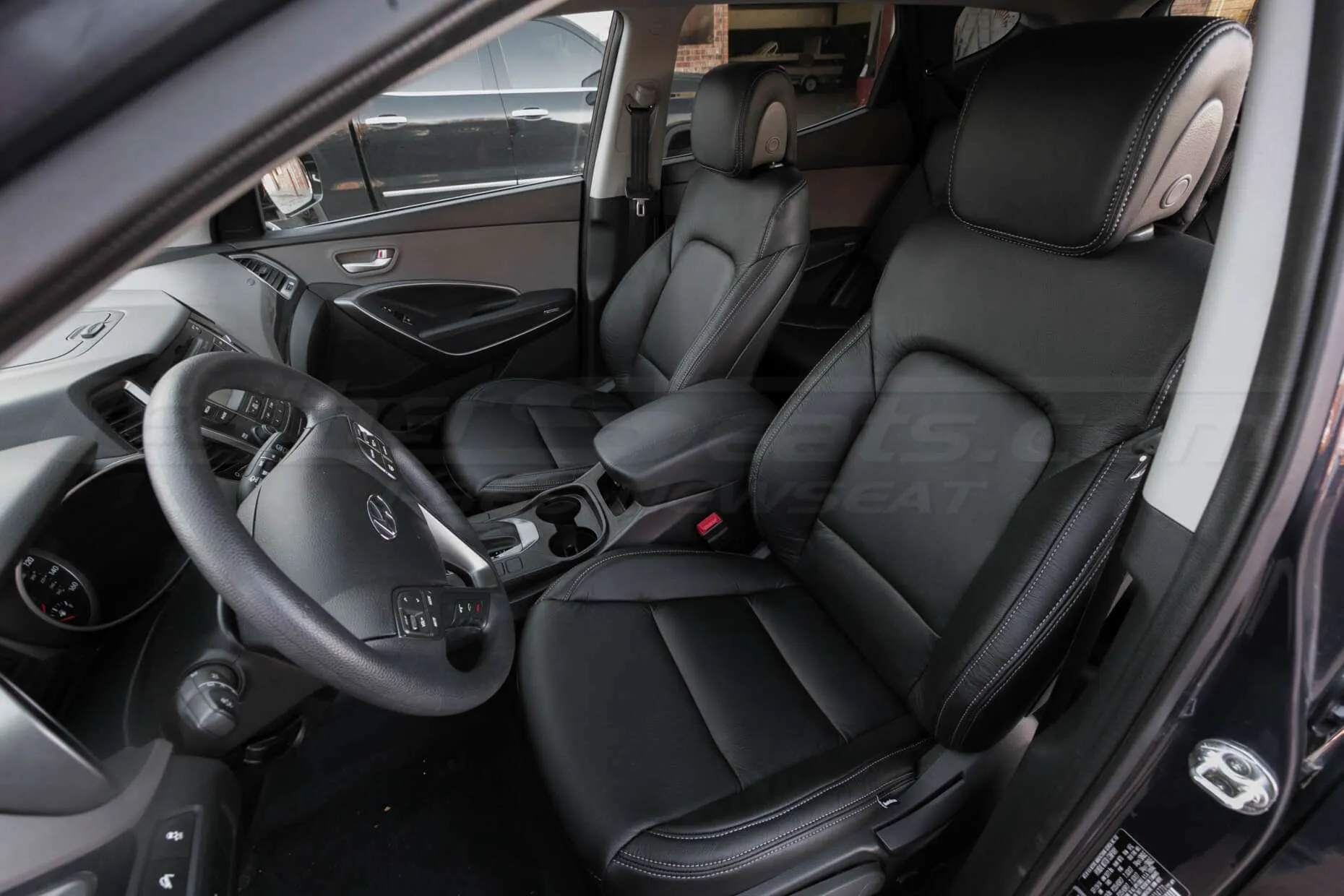 Hyundai Santa Fe Sport installed leather kit - Black - Front row interior - drivers side