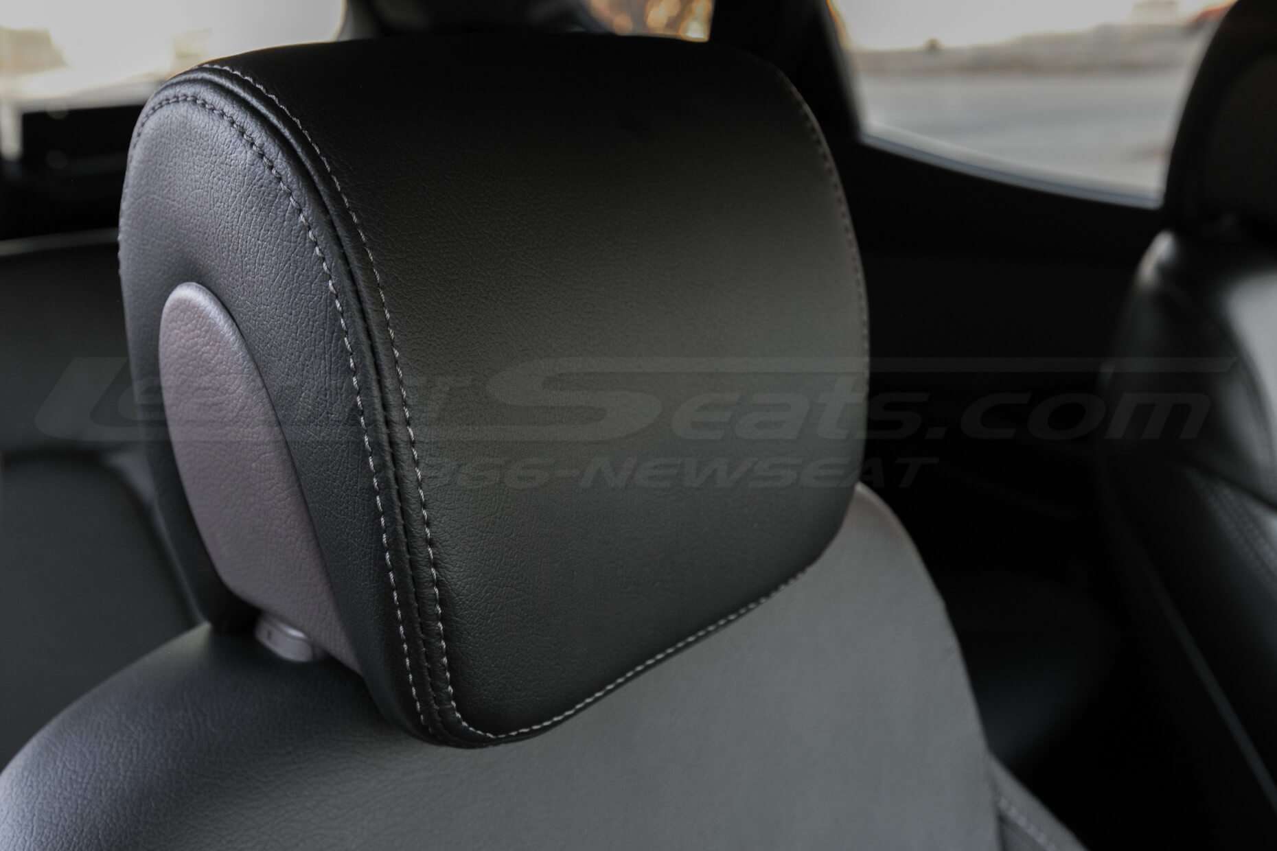 Hyundai Santa Fe Sport installed leather kit - Black - Headrest close-up