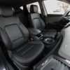 Hyundai Santa Fe Sport installed leather kit - Black - Front interior from passenger side