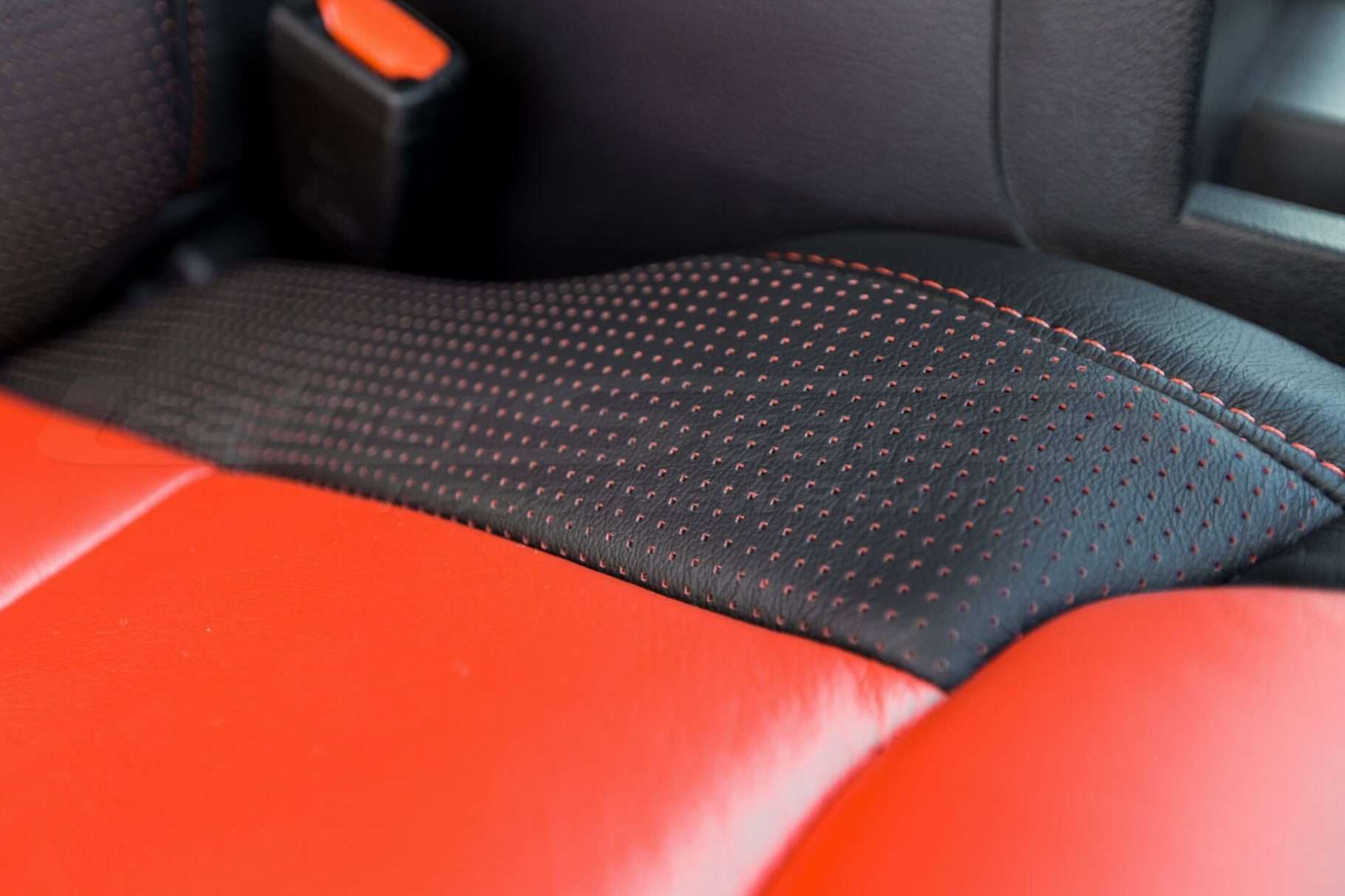 Toyota Tundra Leather Kit Installed - Black & Bright Red - Perforated wing on seat cushion