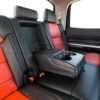 Toyota Tundra Leather Kit Installed - Black & Bright Red - Rear seat with armrest down