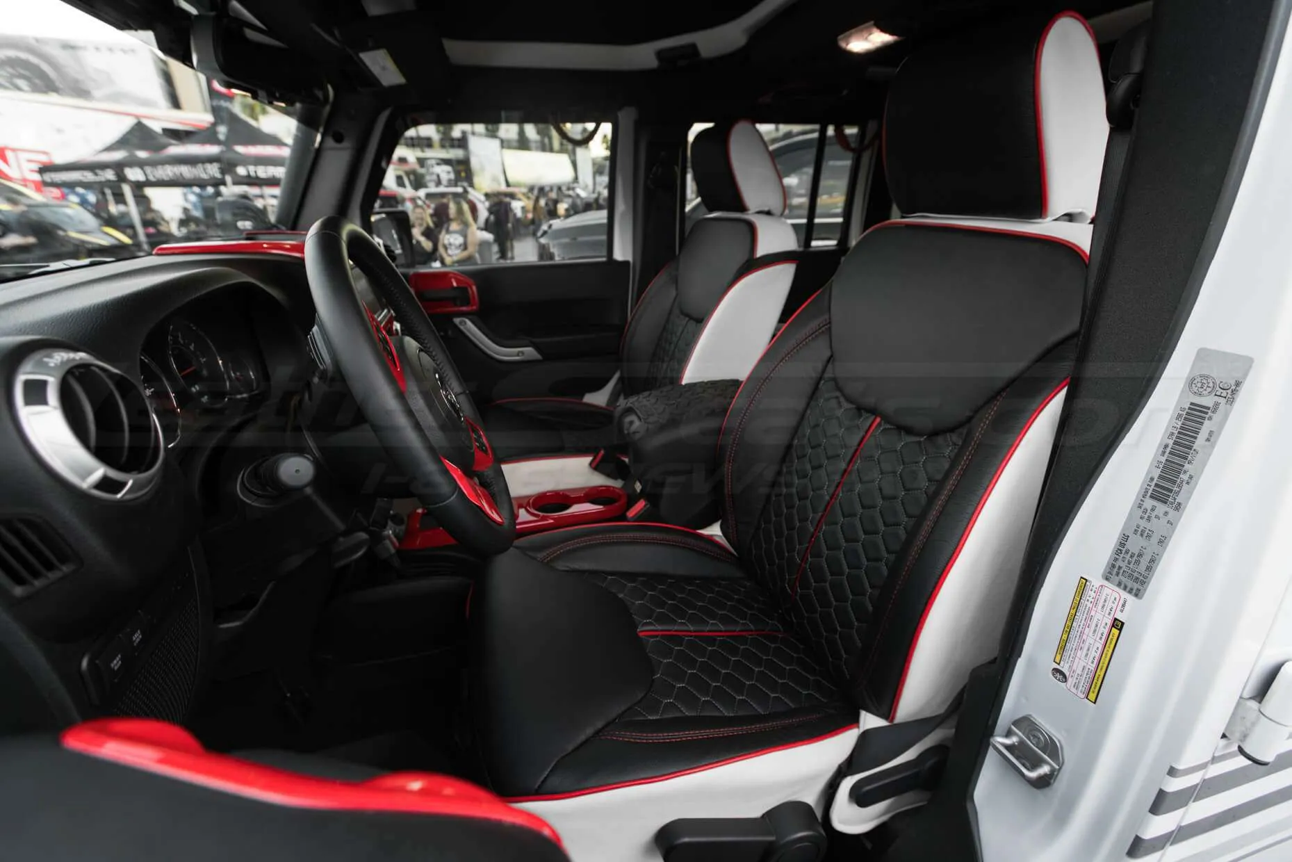 2013-2018 Jeep Wrangler Reticulated Hex installed Upholstery Kit - White/Black/Bright Red - Front interior from drivers side