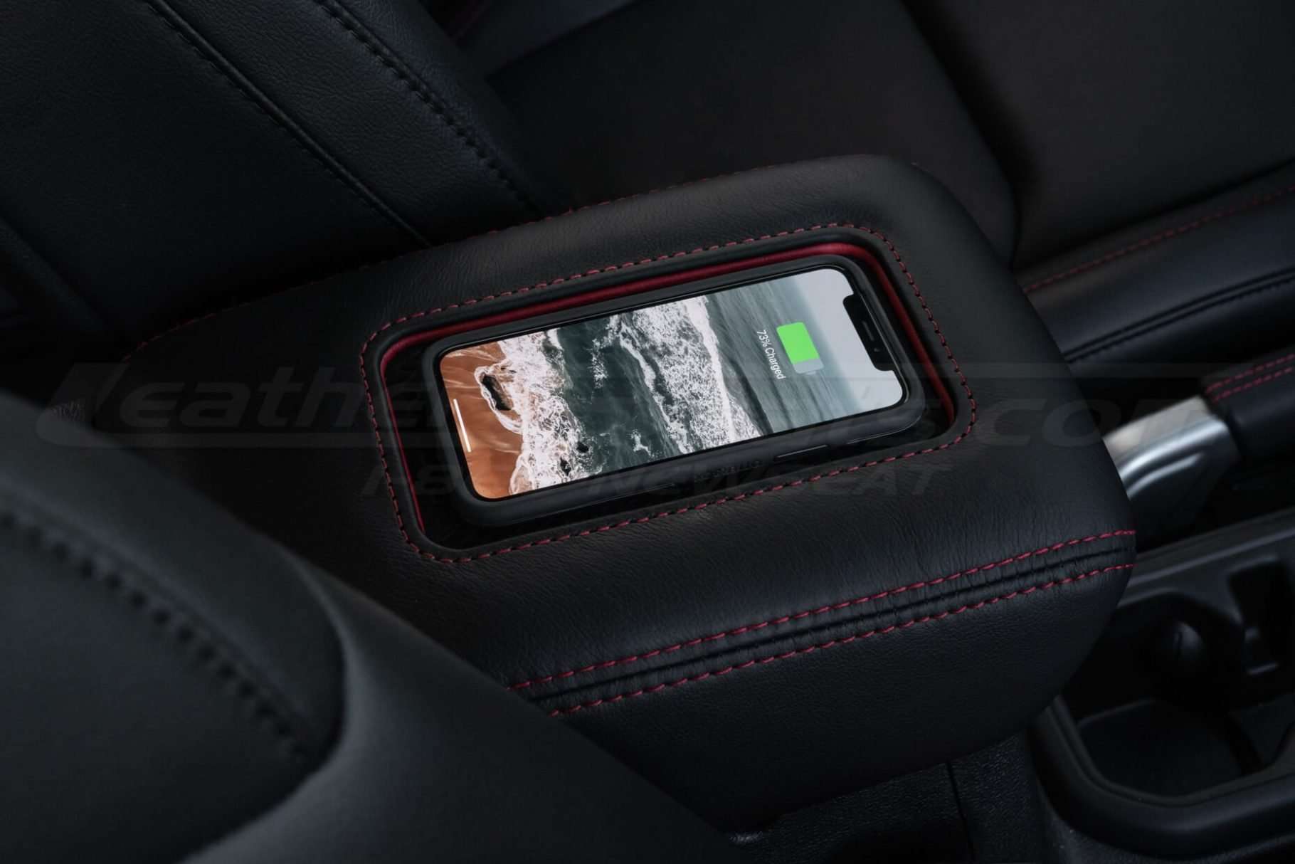 Jeep Sanctum Console charging a phone