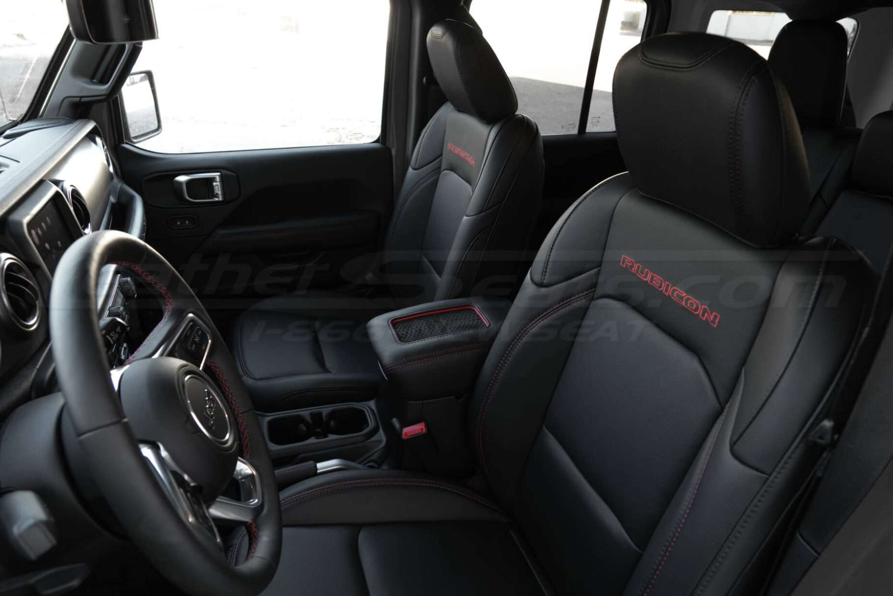 Custom Black Jeep interior with charging phone console