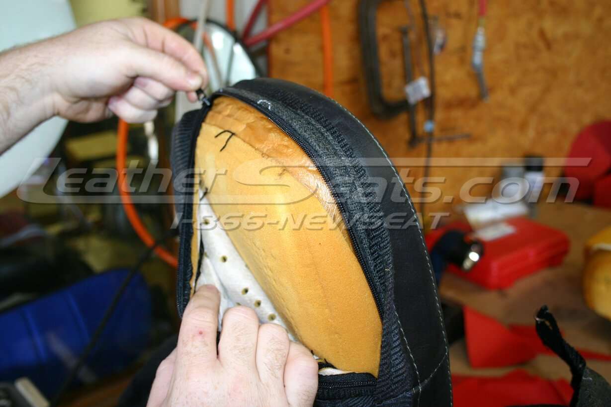 Unzipping headrest to remove factory cloth
