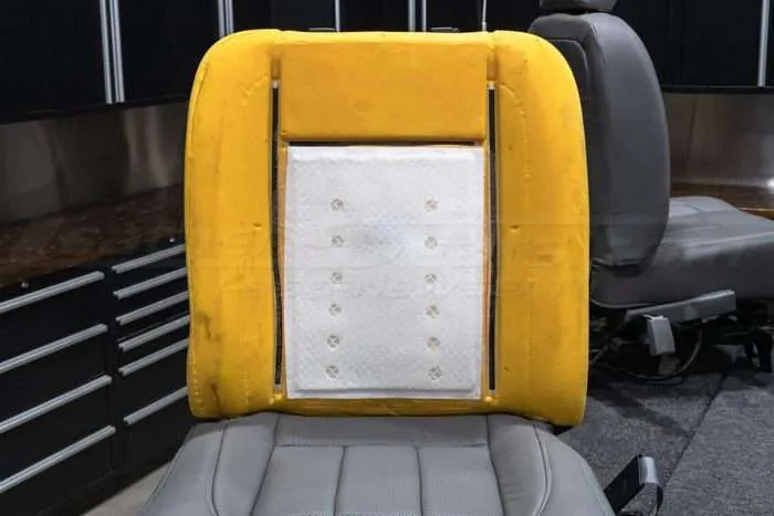 Carbon fiber pad installed on backrest cushion