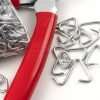 Scattered hog-rings and red hog-ring plier handle