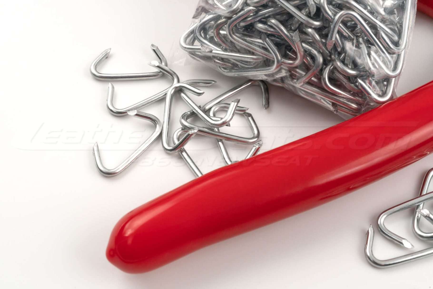 Hog-rings and red hog-ring plier handle