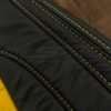 Velocity Yellow double-stitching close-up