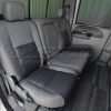 Ford Superduty installed leather seats in light grey and graphite - rear seats from passenger side