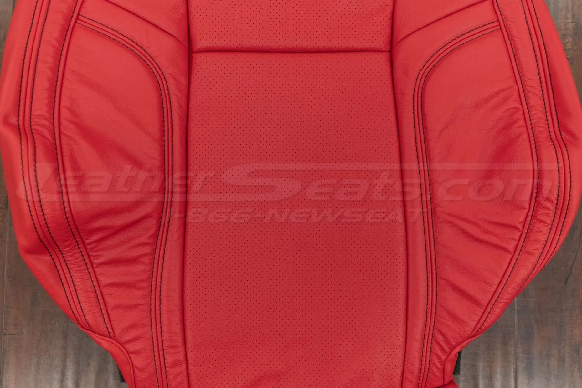 Perforated body on front backrest