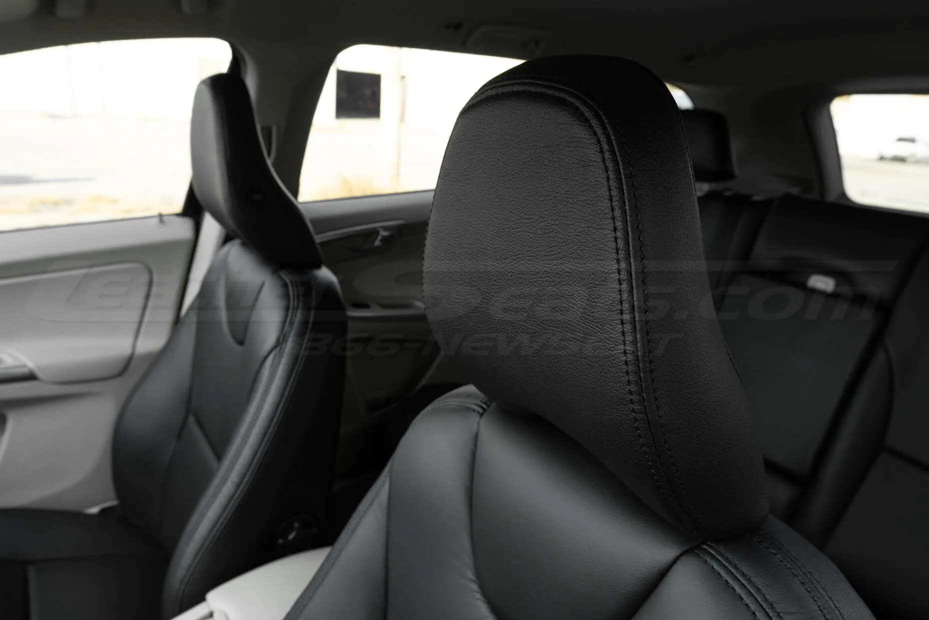 Leather headrest with matching black stitching
