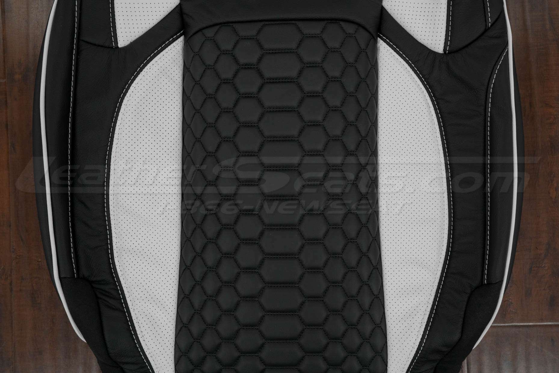 Bottom section of front backrest with convex reticulated hex and perforated wings