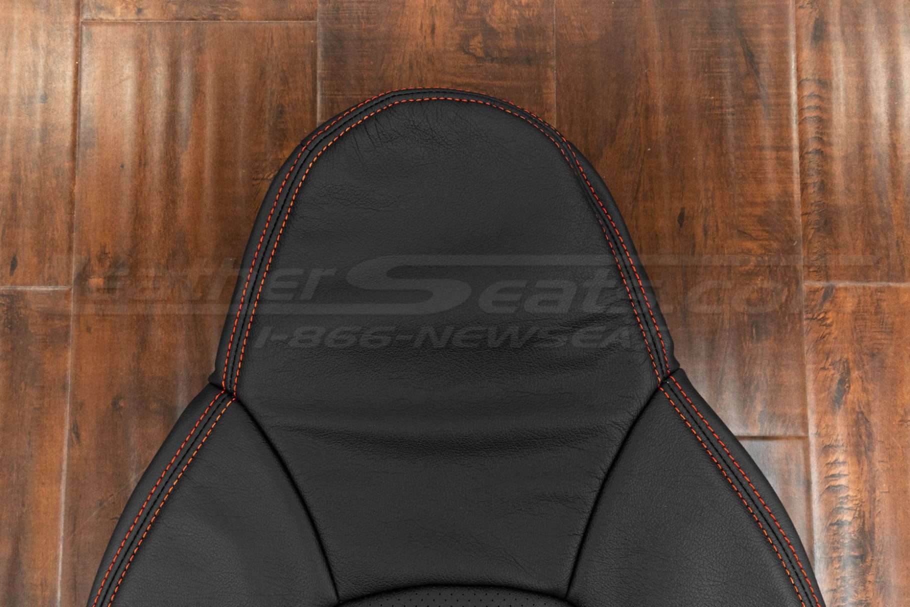 Headrest attached to backrest upholstery