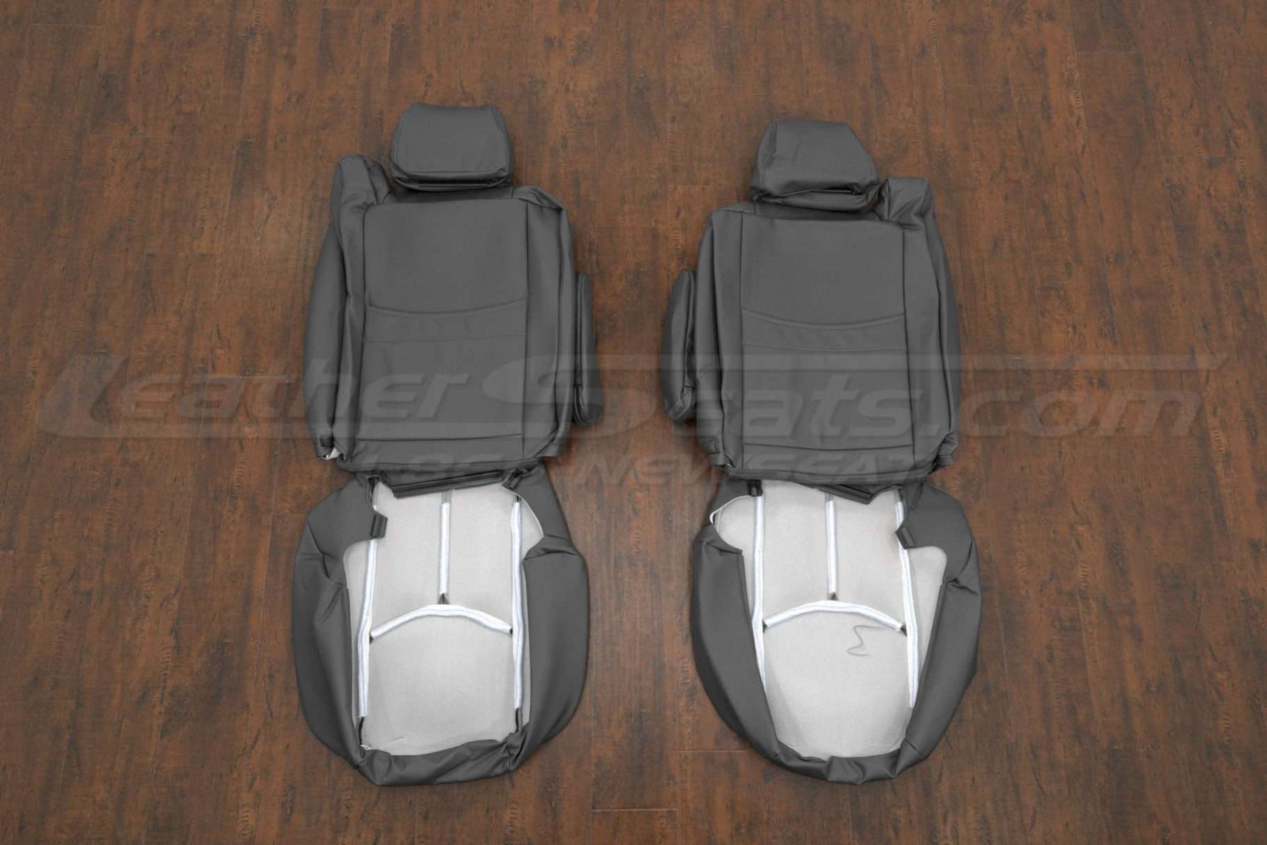 Back view of front seat upholstery w/ armrest