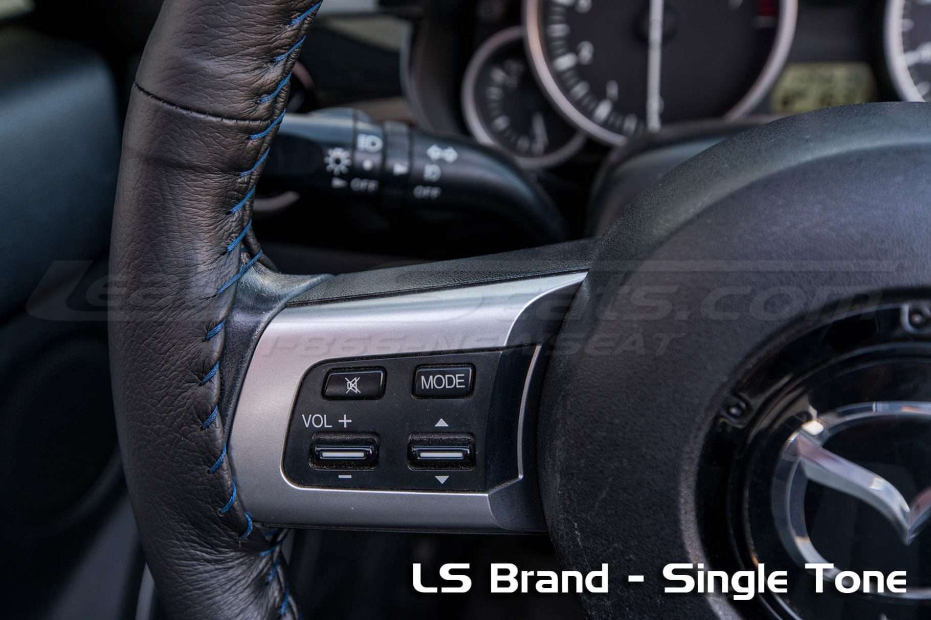 Contrasting double-stitching on steering wheel cover