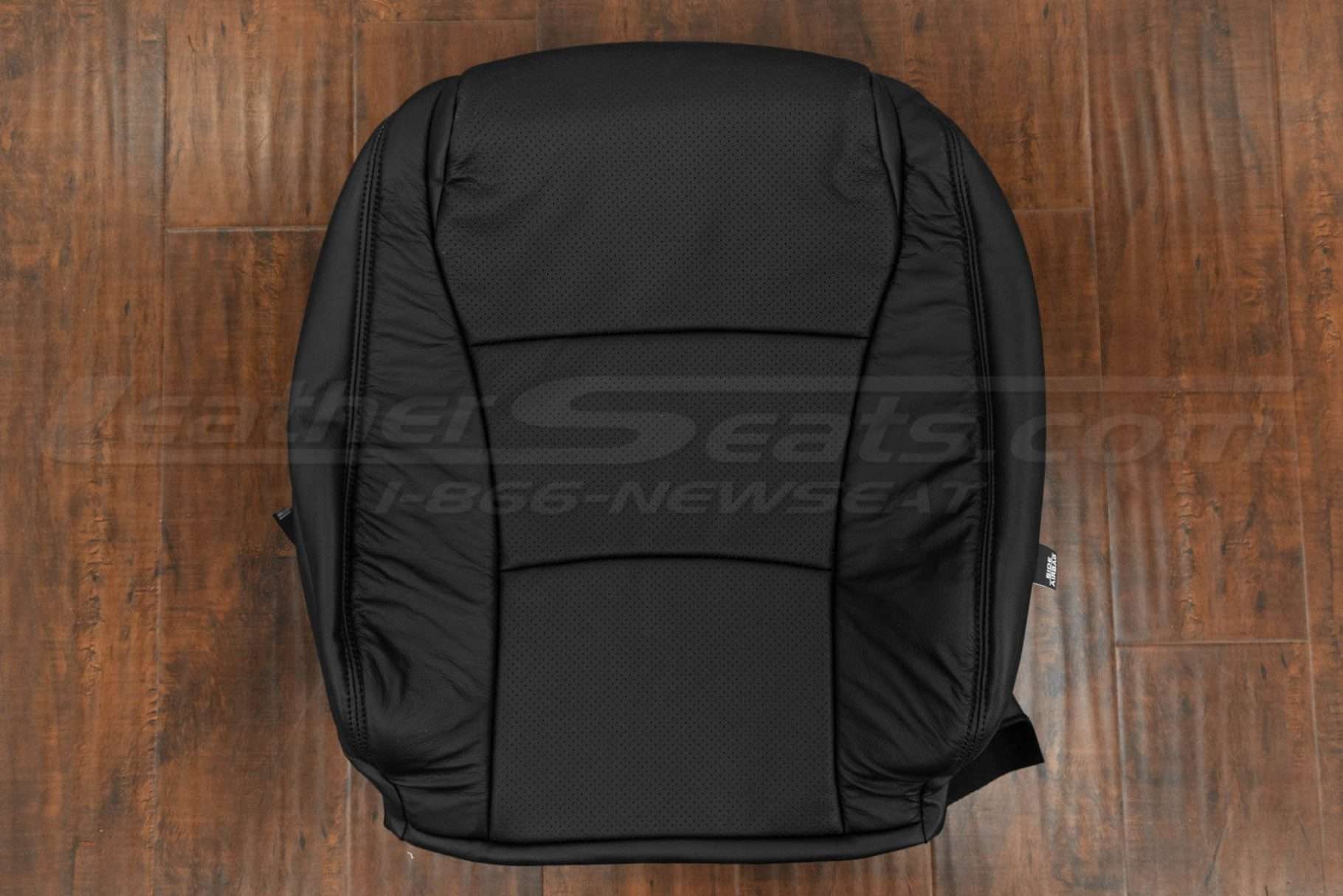 Front backrest upholstery with perforated body