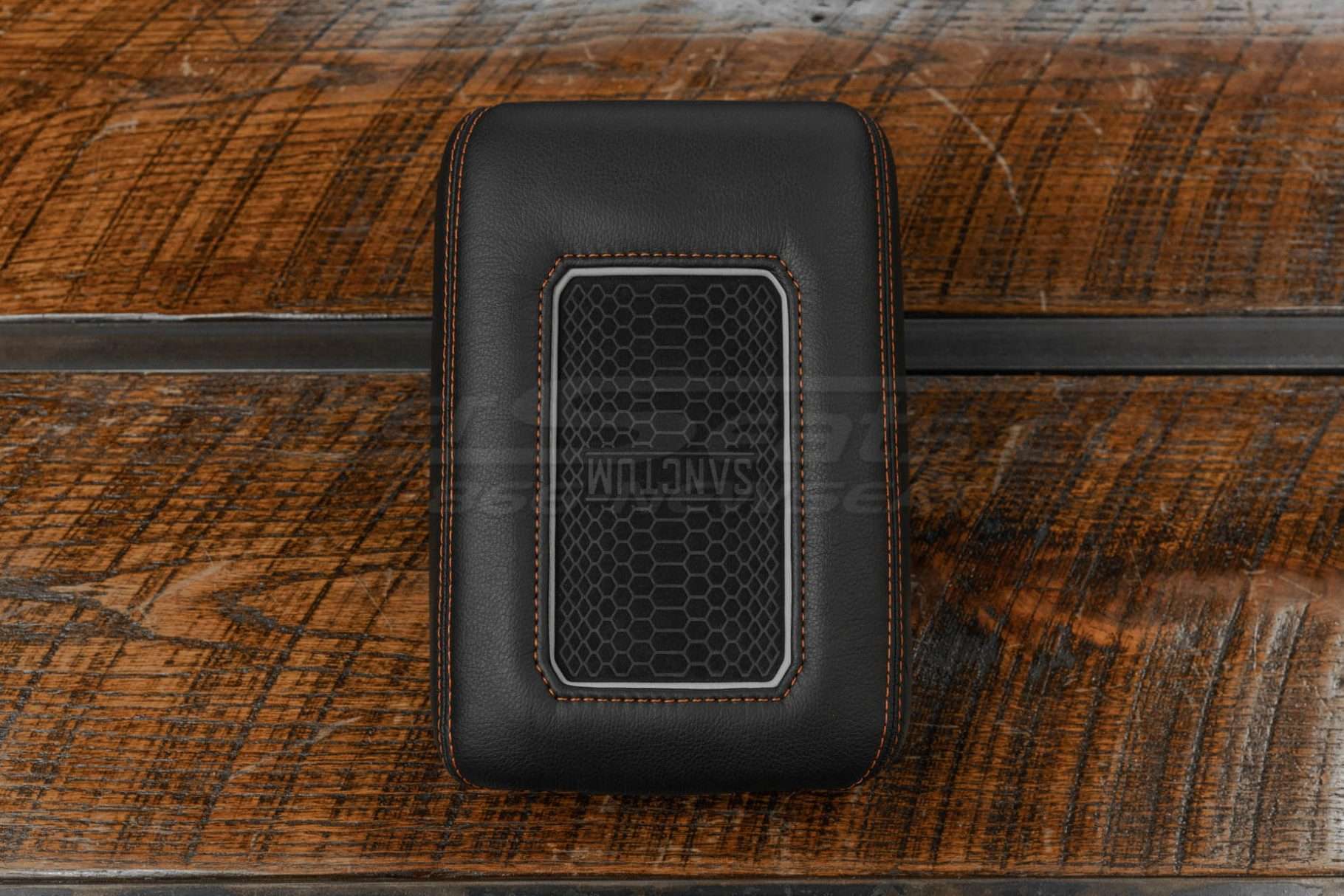 Charging console with Tangerine Stitching and Cement trim ring