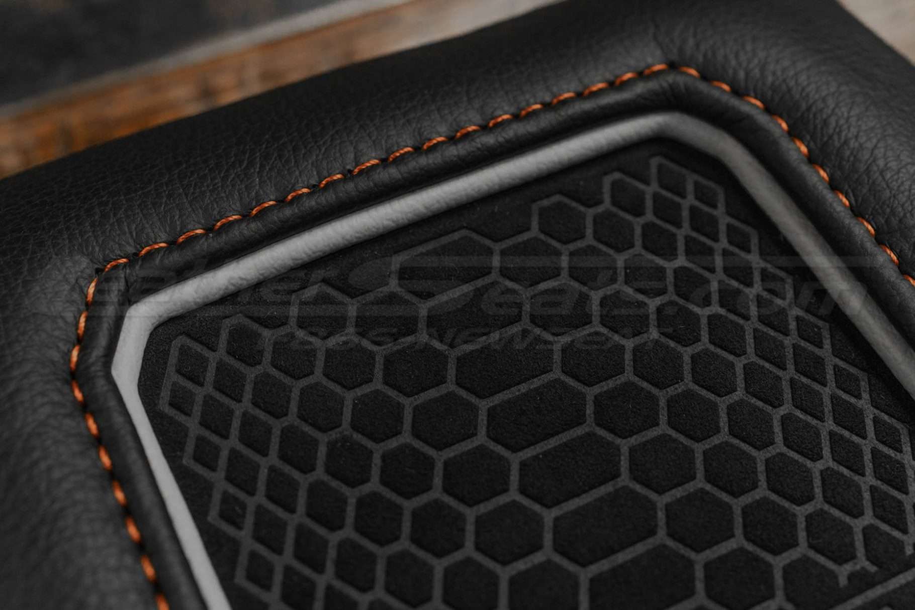 Suede and Tangerine stitching close-up