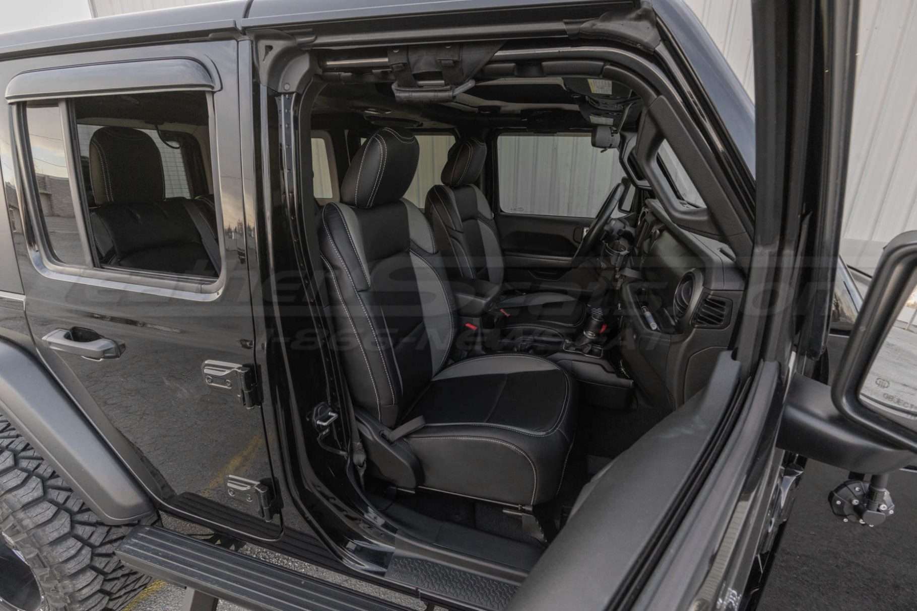 Front passenger installed leather seats medium wide shot