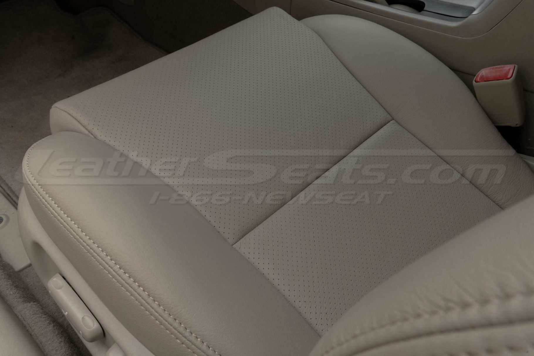 Perforated passenger seat cushion