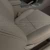 Matching double-stitching and perforated passenger cushion