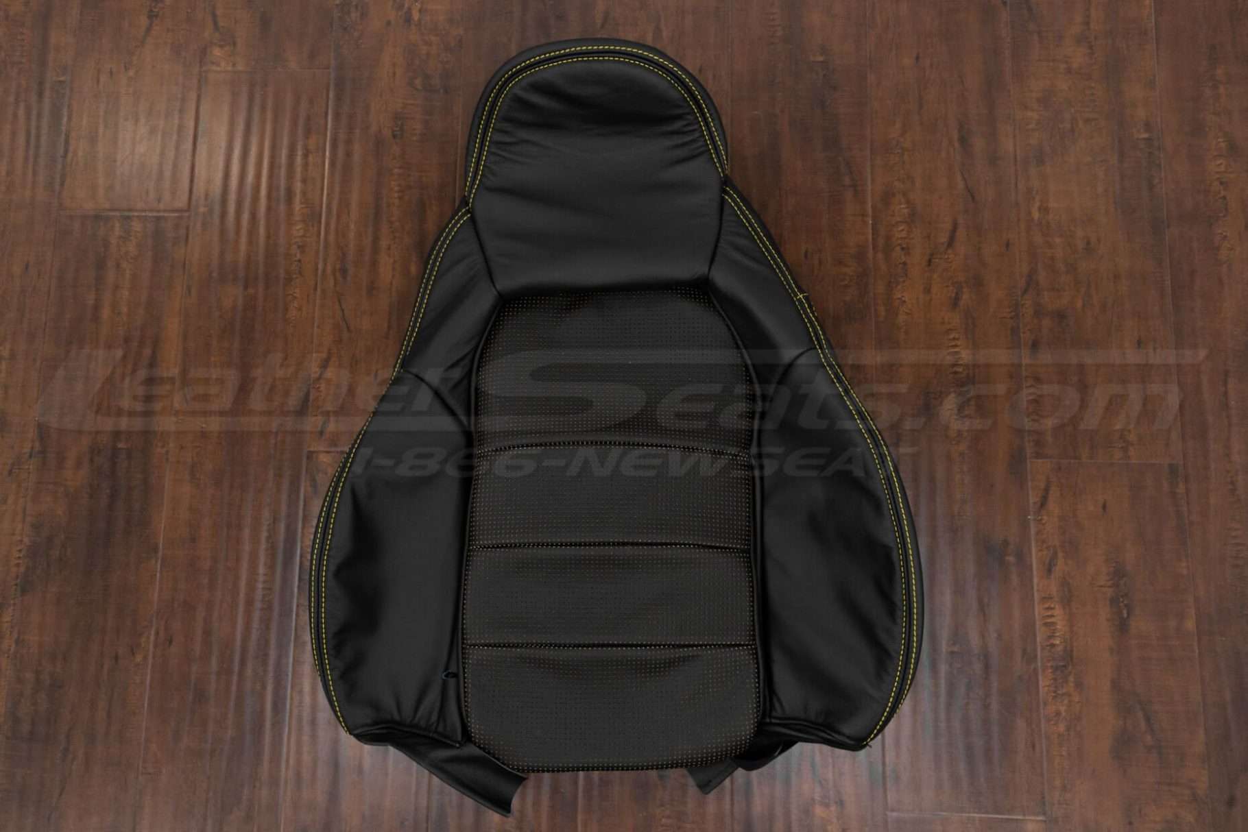 Front backrest upholstery with attached headrest